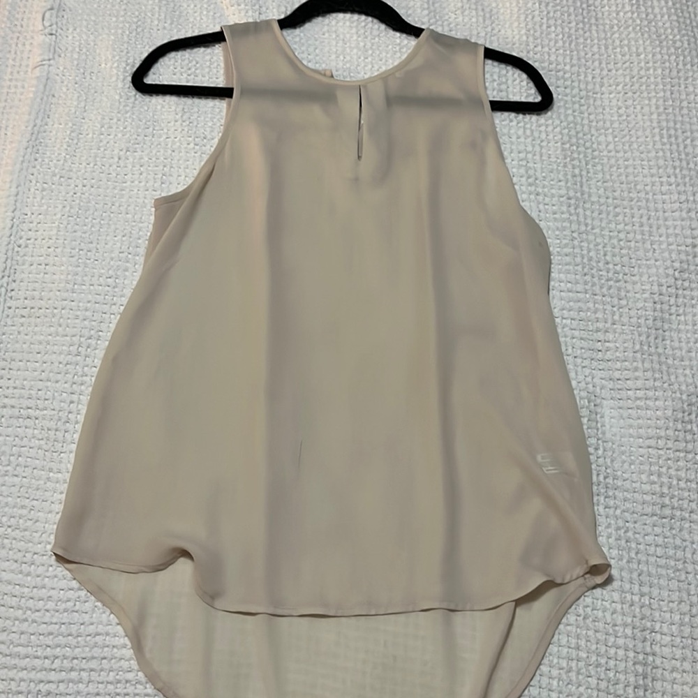Sleeveless beige blouse